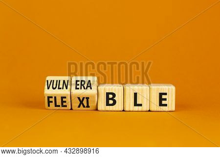 Vulnerable Or Flexible Symbol. Turned Wooden Cubes And Changed Words 'vulnerable' To 'flexible'. Bea