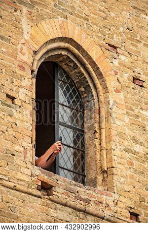 Tourist Taking Photo From A Window Of Medieval Castle Of Serralunga D'alba, Piemonte, Langhe Wine Di