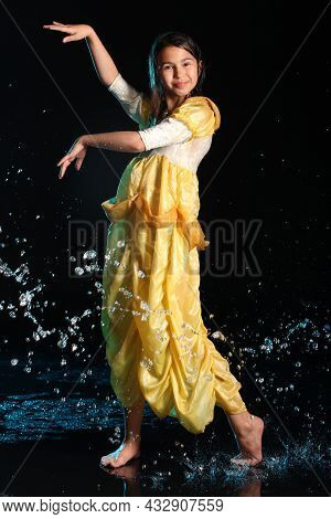 Bright Slender Beautiful And Cheerful Dark-haired Teenage Girl 12 Years Old In A Yellow Silk Dress B