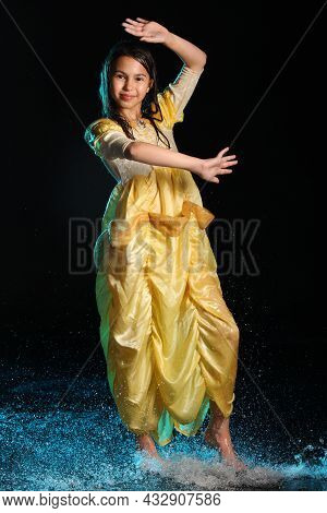 Bright Slender Beautiful And Cheerful Dark-haired Teenage Girl 12 Years Old In A Yellow Silk Dress B