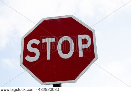 Stop Sign, Traffic Sign Indicating Drivers To Stop And Use Caution At Traffic Junction