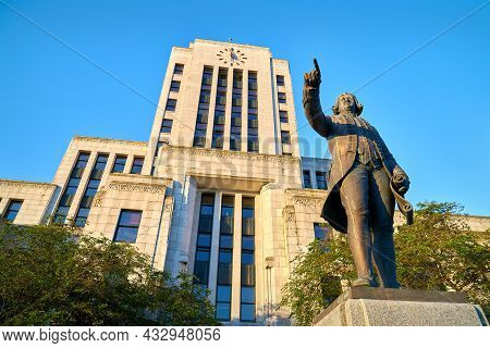 City Hall Morning Vancouver Bc. The Exterior Of The Vancouver City Hall Building With A Statue Of Ca