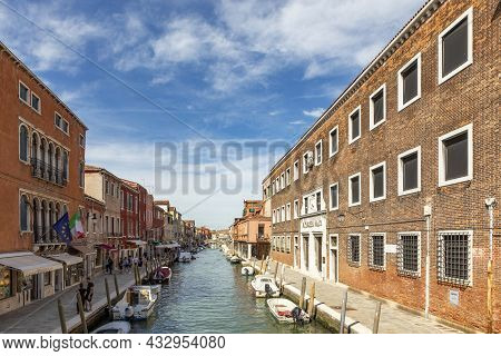 Murano, Italy - July 5, 2021: Scenic View To Island Of Murano In Venice Area With Small Canal And Hi