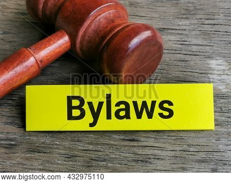 Business And Law Concept. Phrase Bylaws Written On Sticky Note With Gavel.