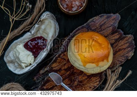 Traditional French Sweet Dessert : Scones On The Wooden Tray Served With Homemade Raspberry Jam And 