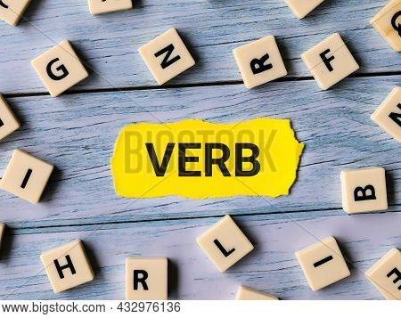 Phrase Verb Written On Paper Strip With A Bunch Of Square Letter.