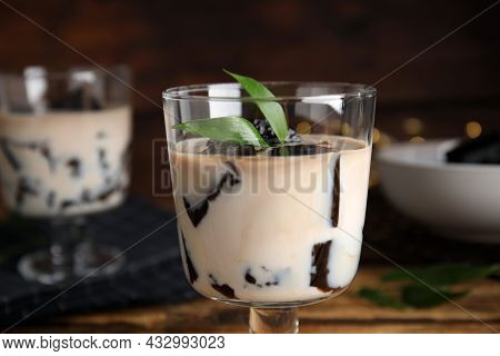 Glass Of Milk With Grass Jelly And Green Leaves, Closeup