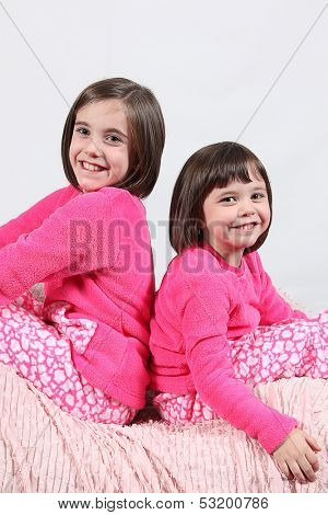 Adorable little girls posing for photos in PJ's