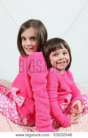 Adorable little girls posing for photos in PJ's