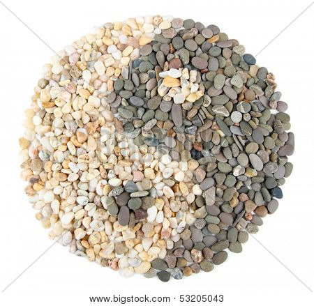 Yin and Yang sign of small sea stones, isolated on white