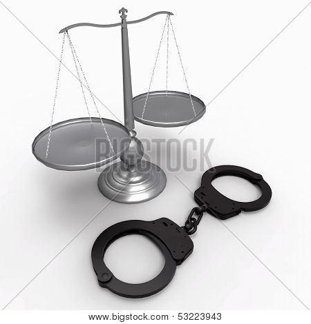 Scales of justice and handcuffs concept