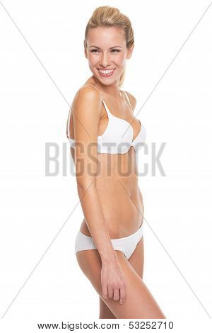 Portrait Of Smiling Young Woman In Lingerie Looking On Copy Spac