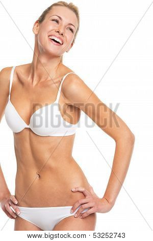 Portrait Of Smiling Young Woman In Lingerie