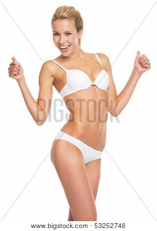 Happy Young Woman In Lingerie Showing Thumbs Up