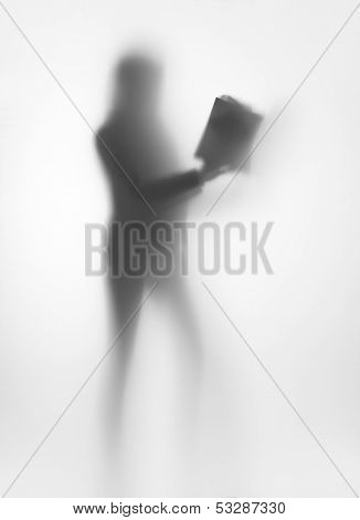 Diffuse woman body shape silhouette, with book in hands