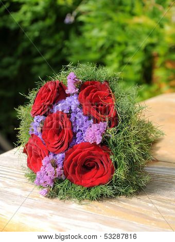 Small Bouquet Of Roses On The Table
