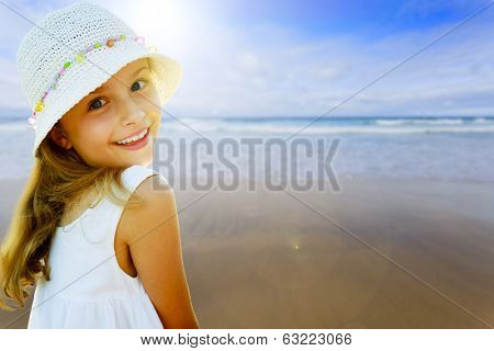 Summer on the beach - lovely girl enjoying summer vacations
