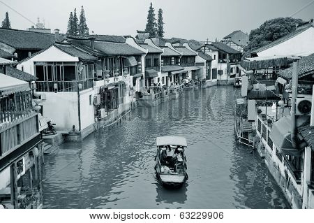 Shanghai Zhujiajiao town with historic buildings over river in black and white
