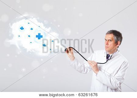 Proffesional doctor listening to abstract cloud with medical signs