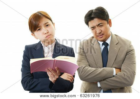 Disappointed businessman and businesswoman