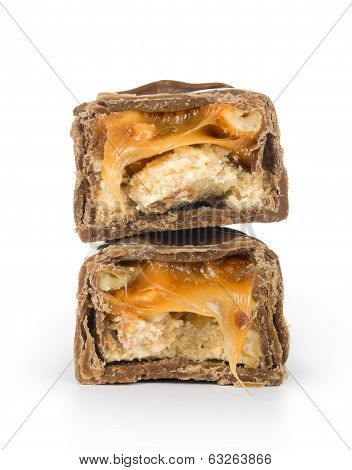 two candy bars with nougat and nuts in the fault zolirovannom on white background