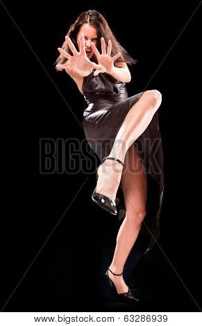 Angry Fighting Woman On The Black Background