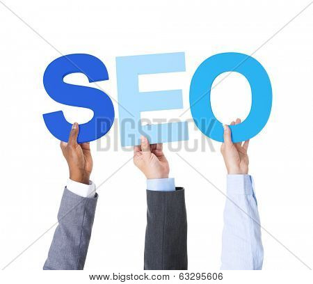 Multiethnic Business People Holding the Word SEO