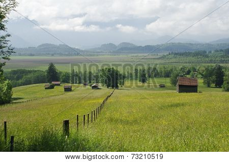 Rural View With Meadow And Mountains