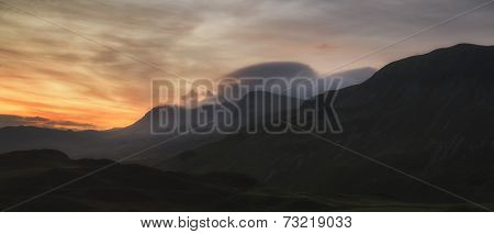 Stunning Sunrise Mountain Landscape With Vibrant Colors And Beautiful Cloud Formations