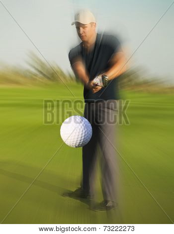 Golf Ball Just Coming Off A Golfer In Swing