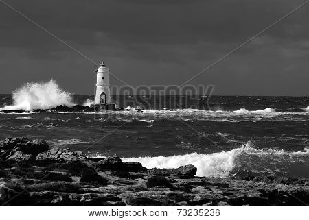White lighthouse on the cliff