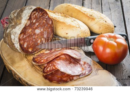 Morcon, A Spanish Sausage With Bread And Tomato