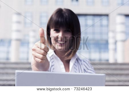 Thumbs Up From Business Woman