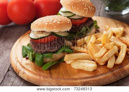 Mini hamburgers served with french fries, classic fast food
