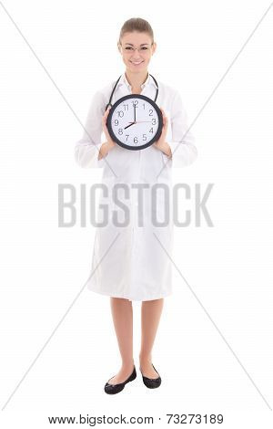 Happy Young Female Doctor Holding Office Clock Isolated On White - Full Length