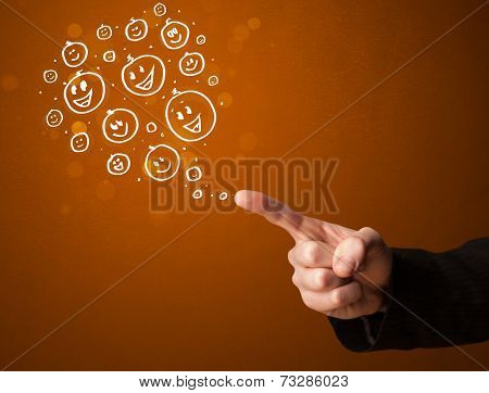 Group of happy hand drawed smiley faces coming out of gun shaped hands