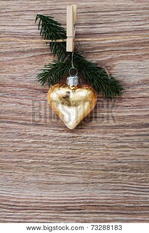 christmas golden heart with green  twig