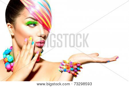 Beauty Woman Portrait with Colorful Makeup, Hair, Nail polish and Accessories. Colourful Studio Shot of Funny Model Girl. Vivid Colors. Manicure and Hairstyle. Rainbow Colors 