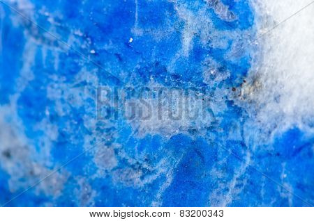 Macro Beautiful fantastic background from Lazurite is a tectosilicate mineral with sulphate, sulphur