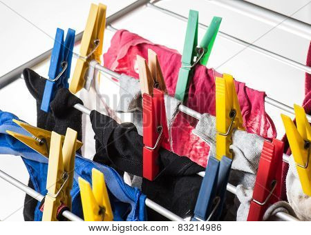Mixed  Clean Laundry Pinned With Colourful Clothespins