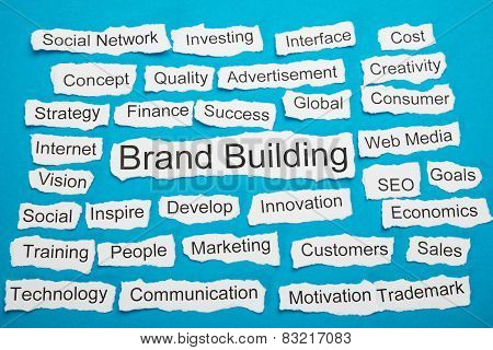 Word Brand Building On Piece Of Torn Paper