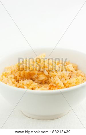 close up of risotto in a white bowl, room for text