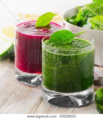 Freshly Squeezed Vegetable Juices On A Wooden Table