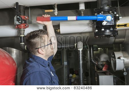 A good serviceman working on a machine room