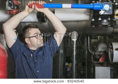 A good serviceman working on a machine room