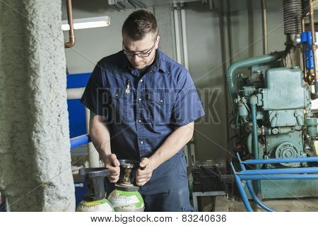 A good serviceman working on a machine room