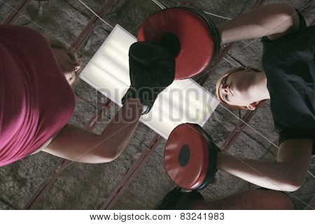 Boxing aerobox group with personal trainer man at fitness