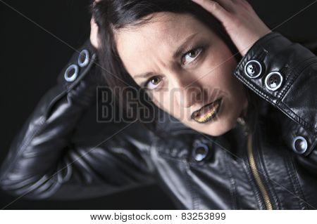 A gothic woman over a dark background,