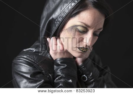 A gothic woman over a dark background,