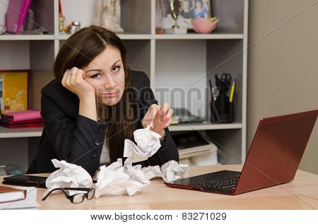 Sad Girl In The Office With A Bunch Of Crumpled Paper